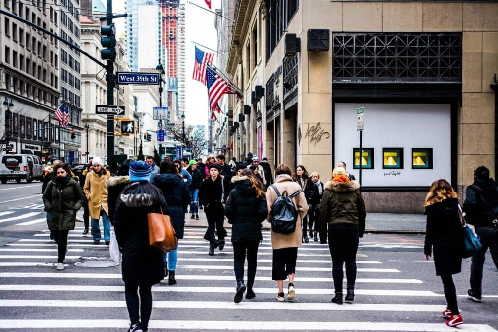 People crossing the street on 5th Avenue in Manhattan, New York City - Behind the Scenes NYC