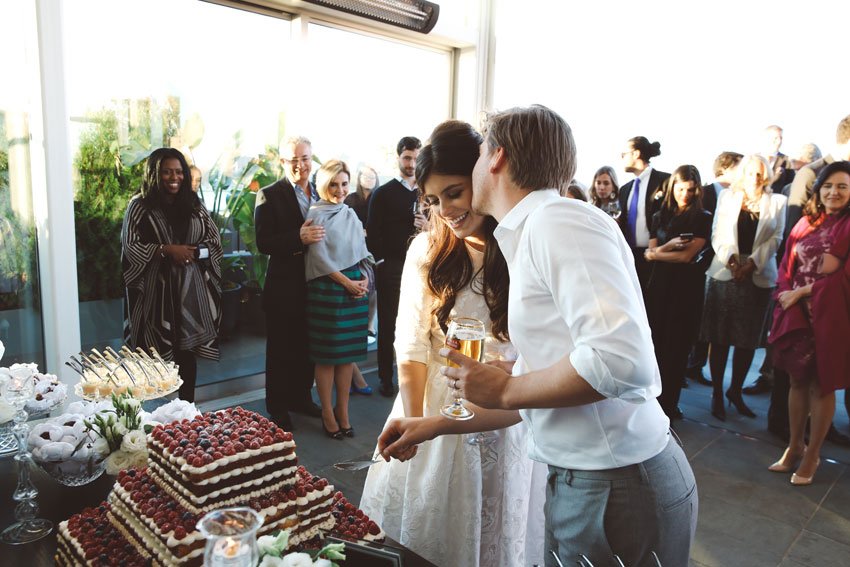 Shop NYC Wedding Fernanda Camoes Press Lounge Cutting Cake